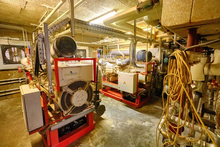 Die an das Blockheizkraftwerk angeschlossene Fernwärmepumpe versorgt 32 Wohnungen.