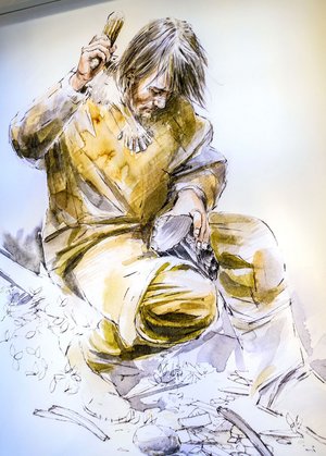 Steinzeitmann beim Werkzeugmachen.