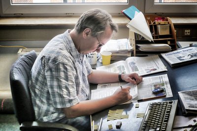 Auf der Suche nach dem Image von Firmen wie Bosch, Porsche oder Greenpeace: Printauswertung bei Infopaq. Foto: Infopaq